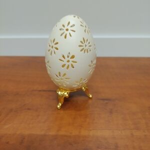 Hand-Carved Goose Egg On A Golden Stand Signed by Artist